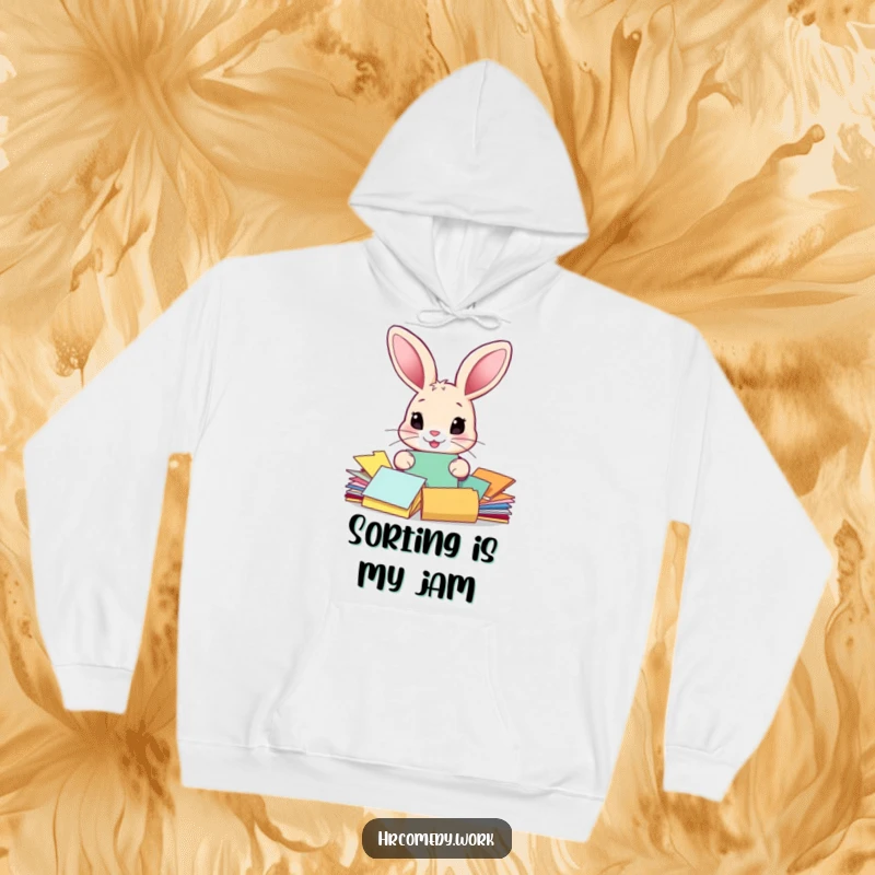 Funny hoodie depicting a large-eared rabbit diligently sorting colorful papers, creating a humorous and endearing visual for cartoon lovers.